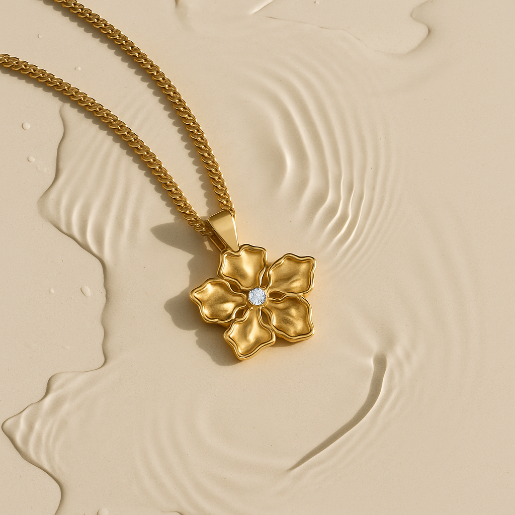 Gold flower pendant necklace with diamond detail in water, handcrafted in London