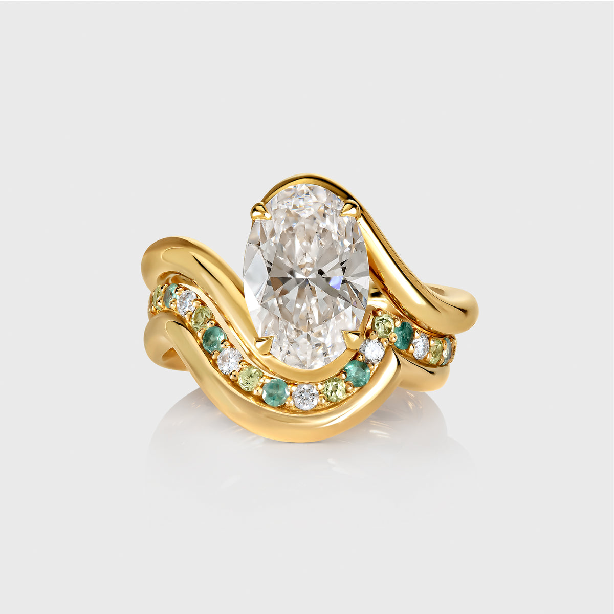 Bespoke engagement rings and wedding rings crafted in 18ct recycled gold, personalised with birthstones to reflect you and your partner’s birth month