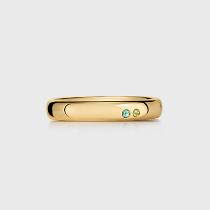 Recycled gold wedding ring with subtle birthstone detailing, sustainable fine jewellery designed in London for meaningful, personal pieces